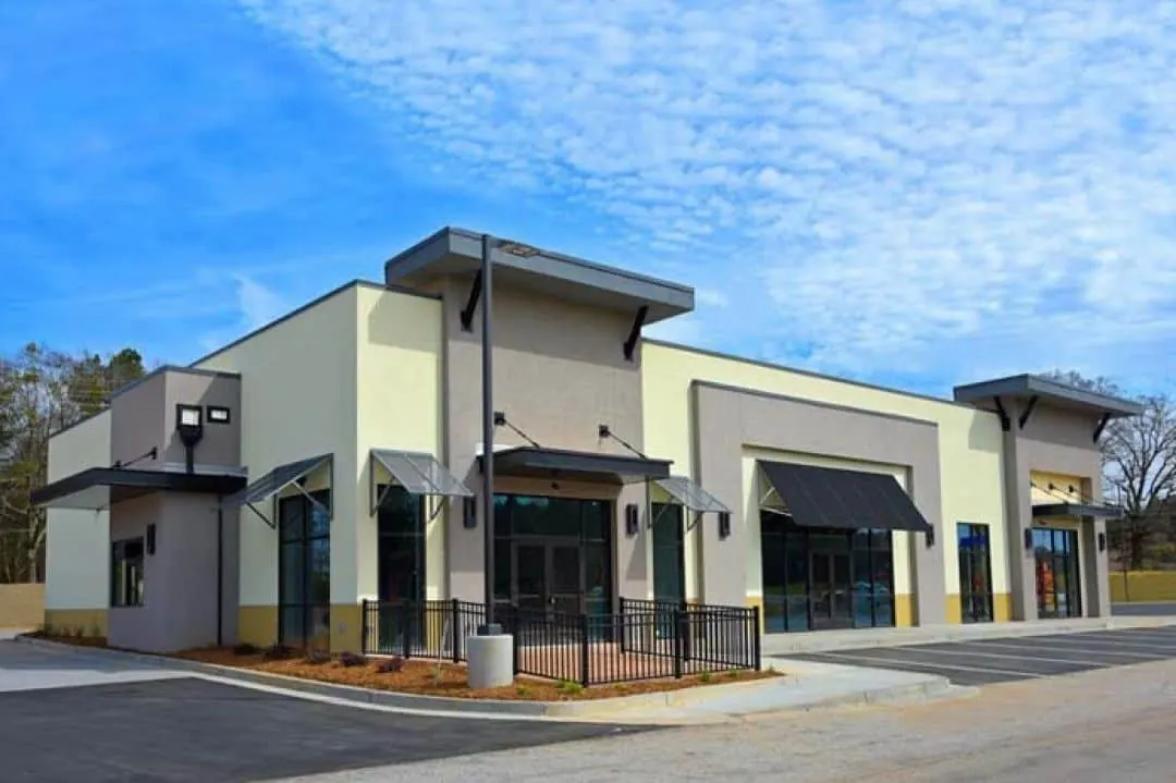 Tucson retail building exterior freshly painted in cream and gray